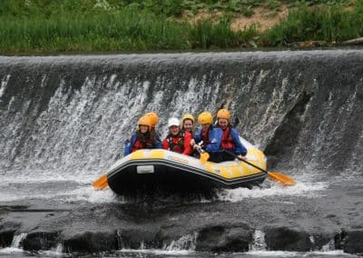 Summer camp navigating a weir on the River Liffey